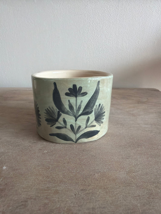 Tasse fleur et carreaux en céramique