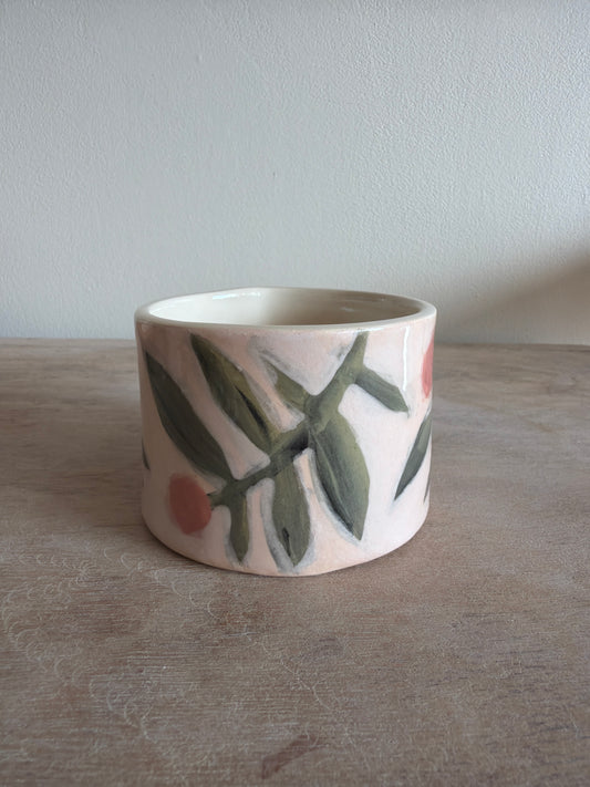 Tasse fleur et carreaux en céramique