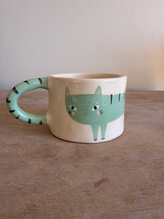 Tasse fleur et carreaux en céramique